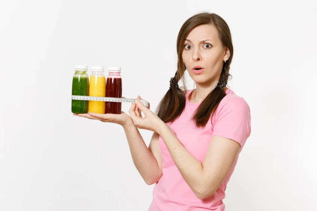 A woman checking her weight while examining the impact of hormones on weight management, emphasizing the connection between hormones and body weight.